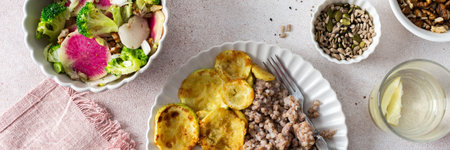 Green buckwheat paired with fried hake, zucchini, and a colorful salad of broccoli, pink radish, and seeds, providing a protein-packed, healthy breakfast to fuel your morning, bannerの写真素材