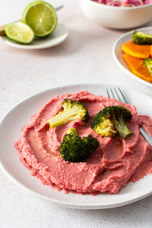 A nutritious morning meal featuring sweet potato, broccoli, radish salad with chia seeds and beet hummus for a balanced, protein-packed startの写真素材