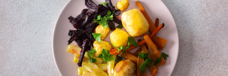 This wholesome meal includes oven-baked potatoes, zucchini, carrots, and beets, perfect for a balanced and savory breakfast or lunch that is both nutritious and satisfying bannerの写真素材