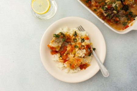White rice with baked vegetables and baked white pollock fish, a delicious hearty lunch or dinnerの写真素材