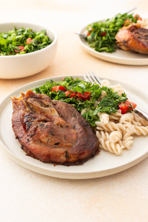 Enjoy a hearty meal with gluten-free pasta and a fresh salad of seasonal vegetables and herbs, complemented by ripe fruits for a balanced and nutritious breakfast or lunchの写真素材