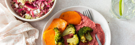 A nutritious morning meal featuring sweet potato, broccoli, radish salad with chia seeds and beet hummus for a balanced, protein-packed start, bannerの写真素材