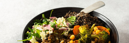 A vibrant, protein-packed breakfast with black quinoa, avocado, chicken, roasted veggies like sweet potato, broccoli, and a fresh salad of cabbage, radish, chia, and sesame seeds, bannerの写真素材