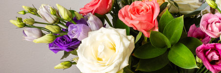 This seasonal bouquet of roses, eucalyptus, and eustoma in soft pink, white, and purple tones makes an ideal gift for anniversaries, birthdays, bannerの写真素材