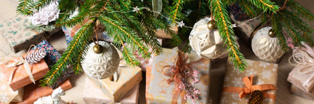 Rustic-themed Christmas gift boxes in natural tones resting beneath a Christmas tree, surrounded by...