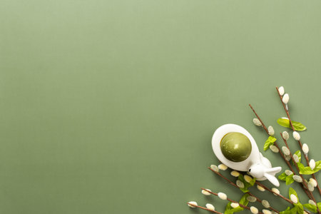 Festive Easter decorations include a cute bunny figurine, colorful egg, and delicate spring...