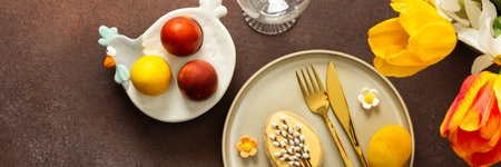 A beautifully arranged Easter table setting showcases a yellow napkin wrapped around a red apple,...