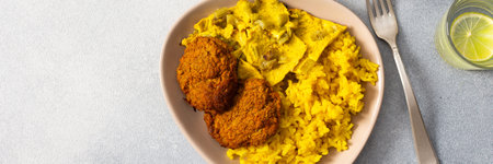 Enjoy a flavorful meal featuring rice topped with fried eggs, baked sweet potato, and colorful...