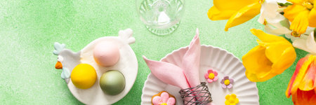 A beautifully arranged Easter table setting showcases a decorative egg nestled in a pink napkin,...