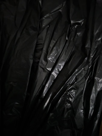 Black  plastic bag as background, close-up.の写真素材