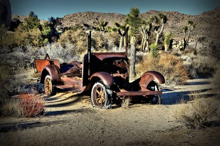 Rusty old car found in the desertの写真素材