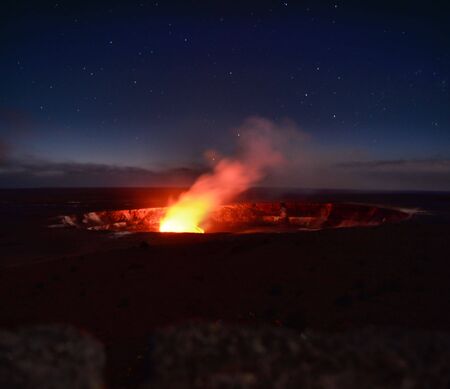 Glowing volcano crater with starsの写真素材