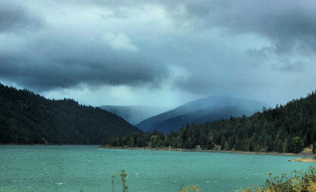 Blue lake, stormy skies