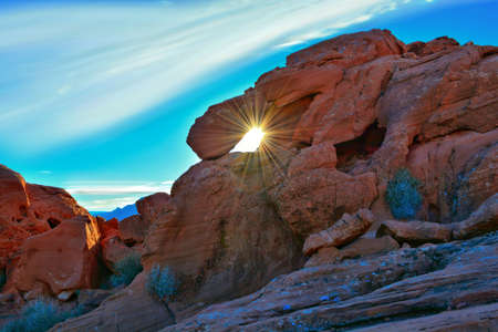 Sunrays through a hole in Sandstone rock formationの写真素材