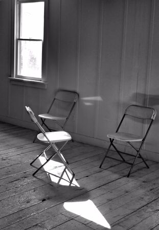 3 folding Chairs in black and whiteの写真素材