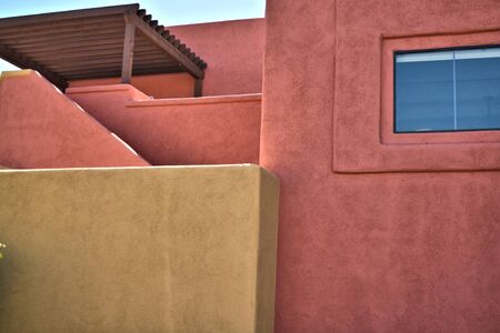 Yellow and salmon colored buildingの写真素材