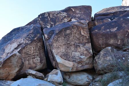 Petroglyphs on a rock faceの写真素材
