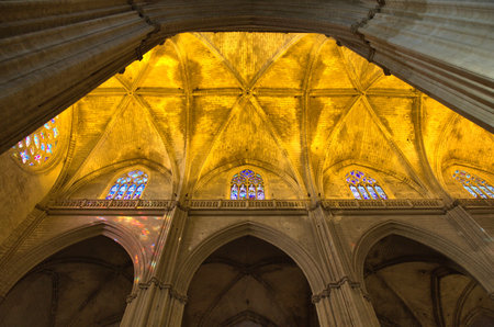 Cathedral with yellow ceiling and stained glassの写真素材