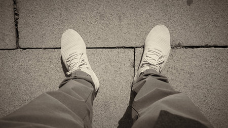 Top view of Sport Shoes with stone road backgroundの写真素材