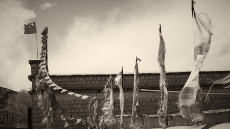 Old flags on the building with black and white tone