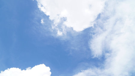 Clear blue sky with some cloudの写真素材