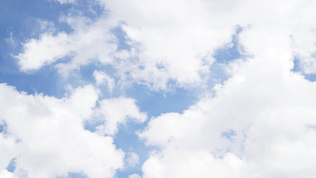 Clear blue sky with some cloudの写真素材