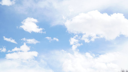 Clear blue sky with some cloudの写真素材