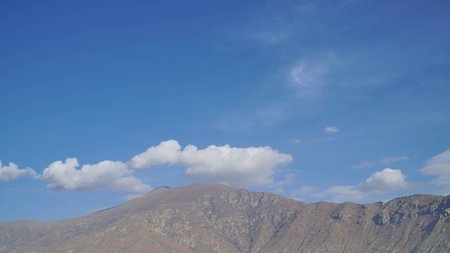 Mountain with some cloud on the blue clear skyの写真素材
