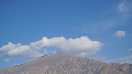 Mountain with some cloud on the blue clear skyの写真素材
