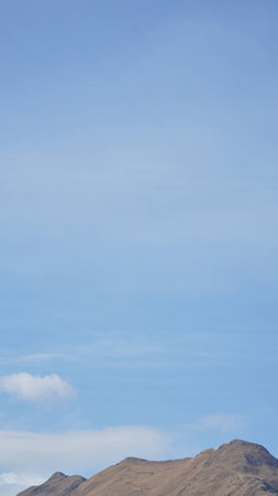 Mountain with some cloud on the blue clear skyの写真素材