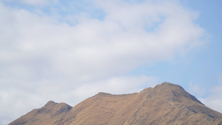 Mountain with some cloud on the blue clear skyの写真素材