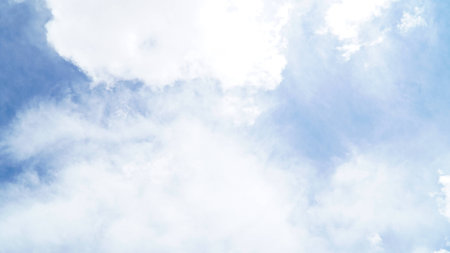 Clear blue sky with some cloudの写真素材