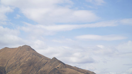 Mountain with some cloud on the blue clear skyの写真素材