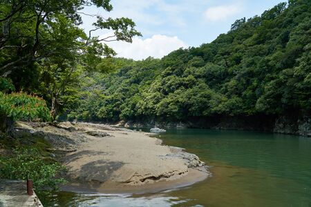 Katsura river and shore with forestの写真素材