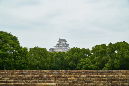 Himeji Castle,Himeji,Japan - July 8,2019 : Himeji castle with tree and old wallのeditorial素材