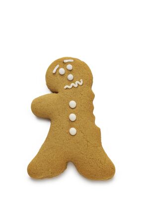 A concerned looking gingerbread man having just lost an armの写真素材