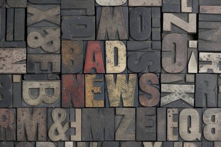 The words Bad News written in very old letterpress typeの写真素材