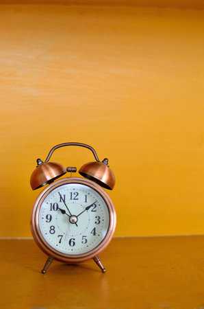 alarm clock and orange background