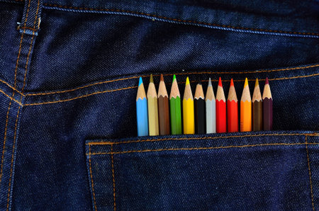 Colored pencils in jeans pocket