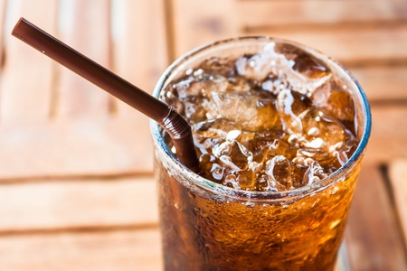 Cold glass with ice  black soda drinkの写真素材