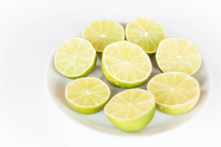 Fresh lime slice on white ceramic dishの写真素材