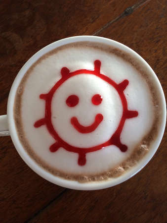 Cup of hot chocolate with sun smileの素材