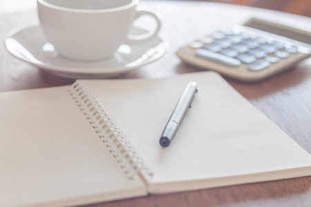 Blank notebook with pen on wooden table, stock photoの写真素材