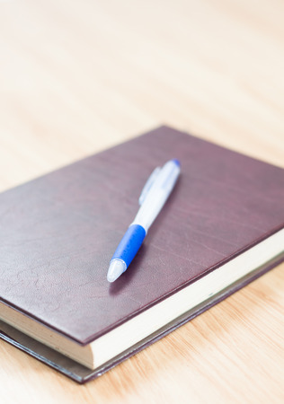 Classic leather notebook with pen, stock photoの写真素材