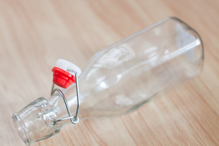 Vintage water bottle on wooden background, stock photoの写真素材