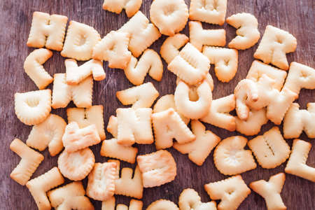 Alphabet biscuit on wooden table, stock photoの写真素材