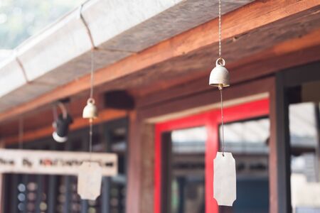 Bell hang on wooden roof, stock photoの写真素材