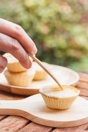 Mini pies on wooden plate, stock photoの写真素材