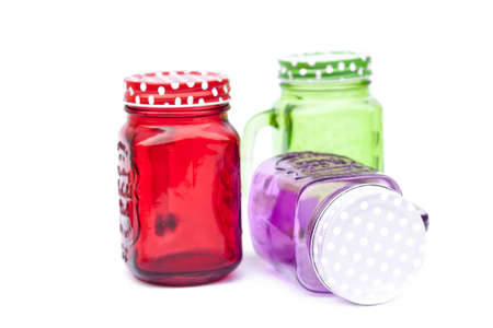 Colourful mason glasses on white background, stock photoの写真素材