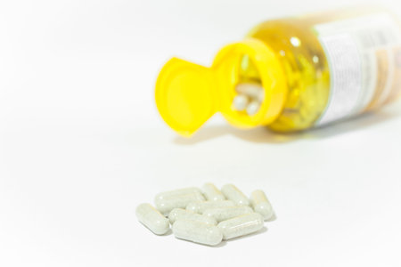 Close up capsules pill on white background, stock photo